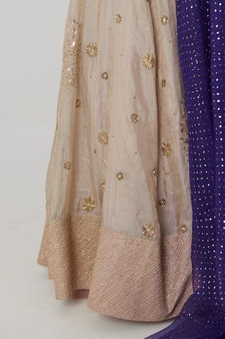 Gold banarasi silk tissue kalidar lehenga with bahar embroidery using sequin, aari and zardozi highlights. Paired with a purple half sleeves chevron fleur woven banarasi silk brocade blouse and blue-purple ombre mukaish embroidered organza dupatta. - Aza Fashions Diwali Tissue Silk Sharara With Gota Work, Chanderi Sharara With Dori Work For Reception, Traditional Chanderi Anarkali Set For Reception, Reception Cutdana Chanderi Sharara, Festive Slub Silk Sharara With Pallu, Traditional Drape Raw Silk Sharara With Dori Work, Slub Silk Sets With Dori Work For Wedding, Festive Raw Silk Anarkali Set With Dori Work, Reception Chanderi Salwar Kameez With Dori Work