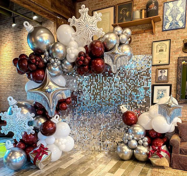 a room filled with lots of balloons and decorations