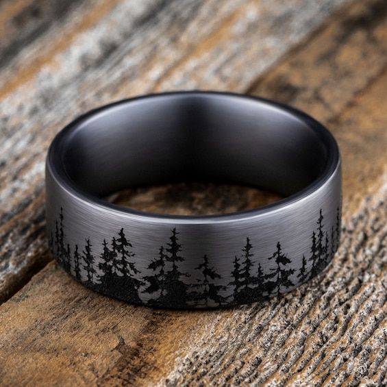 A striking forest-inspired motif rings the circumference of this handsome men's wedding band. Fashioned in tantalum, the inside of the ring is lined with smooth black tantalum to complete the look. The band features Comfort-Fit, which gives a narrower feel than it's actual width when worn. Comfort-Fit rings are designed to have a slightly rounded inside surface so less of the metal touches your finger, which enhances the feel of the ring while wearing and sliding it on and off your finger. Celtic Knot Wedding Ring, Western Wedding Rings, Nature Wedding Ring, Antler Wedding Band, Engagement Ring For Him, Stainless Steel Wedding Ring, Groom Ring, Promise Rings For Guys, Black Wedding Band