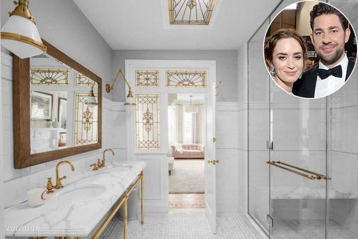 a bathroom with marble counter tops and gold accents on the walls, along with a photo of a man in a tuxedo