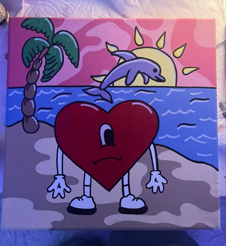 a painting of a heart on the beach with a dolphin jumping out of it's mouth