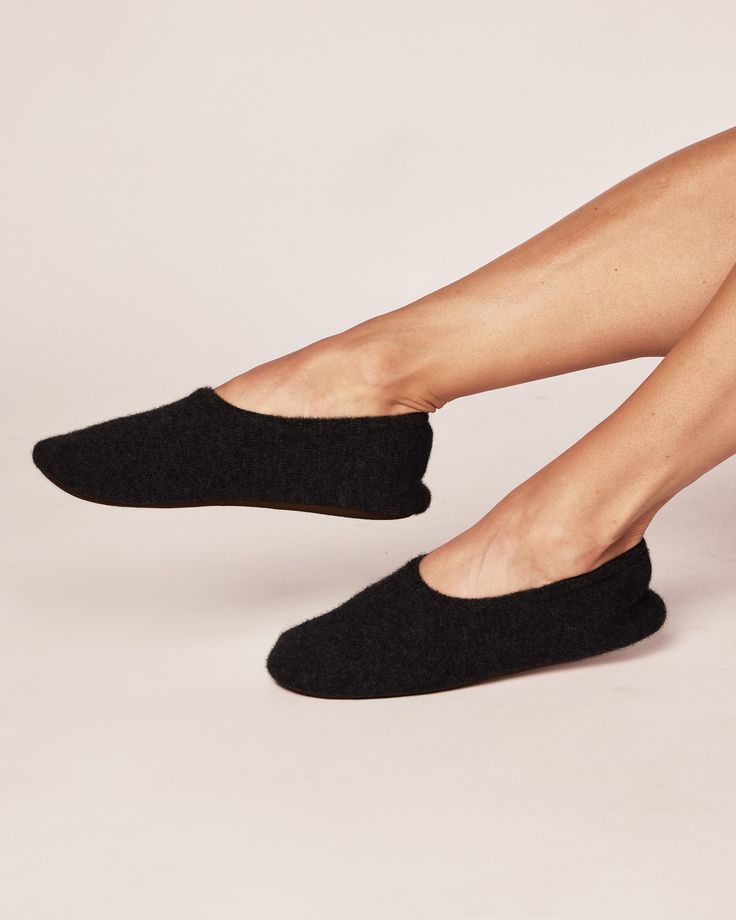 Step into a world of relaxation with our Cashmere Slippers. Made from Grade A 100% pure cashmere, these slippers cocoon your feet with unrivaled softness. Sink your toes into the plush texture and experience instant warmth and comfort. The meticulous craftsmanship ensures a snug and cozy fit making these slippers a delightful treat for your feet. Lining of insole is 100% cotton, comes with slipper bag. Comfortable Slip-on Slippers With Soft Texture, Super Soft Cozy Slippers For Relaxation, Cozy Super Soft Slippers For Relaxation, Cozy Slippers For Relaxation, Comfy Soft Slippers For Relaxation, Soft Slip-on Slippers For Relaxation, Soft Cozy Slippers, Slip-on Soft Slippers For Relaxation, Soft Cozy Comfortable Slippers