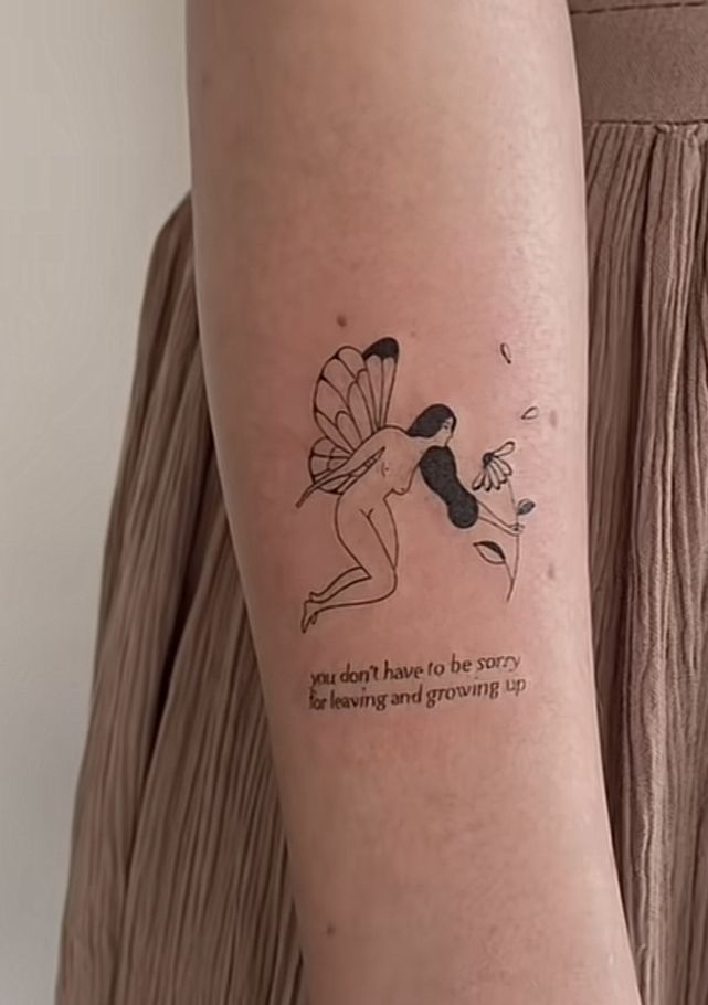 a woman with a tattoo on her arm that reads, i hope to be sorry