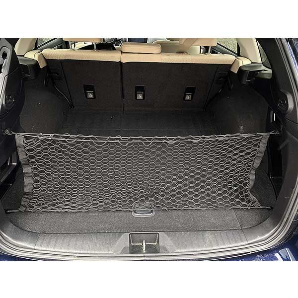 the back end of a blue car with its trunk and cargo trays folded open