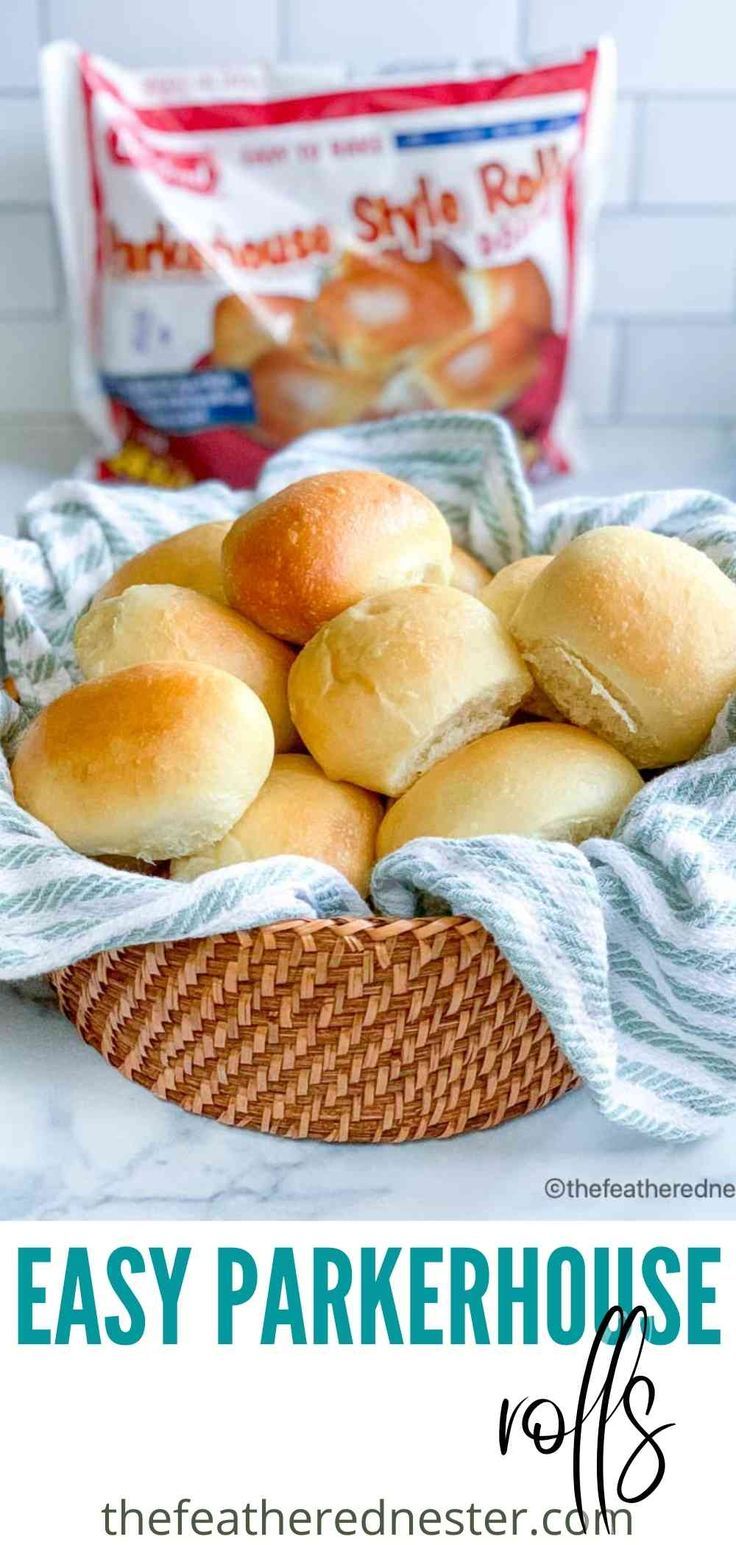 a basket filled with rolls sitting on top of a counter next to a bag of bread