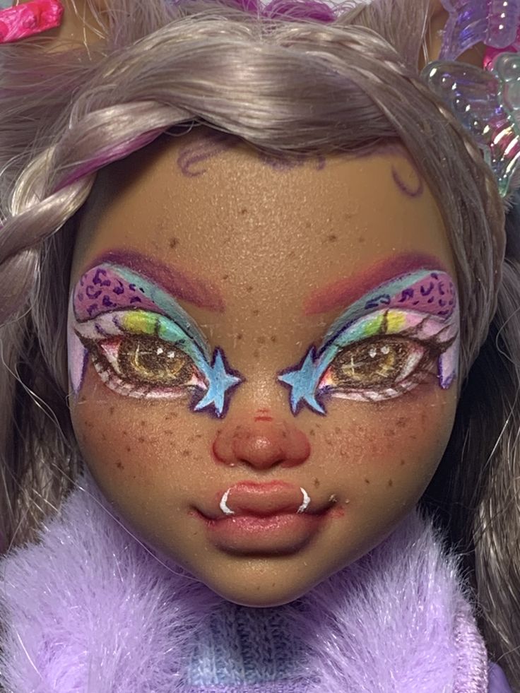 a close up of a doll with makeup and accessories on it's face,