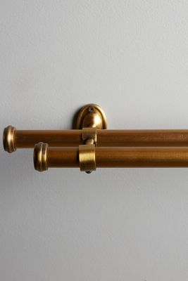 an old fashioned brass toilet paper roll holder