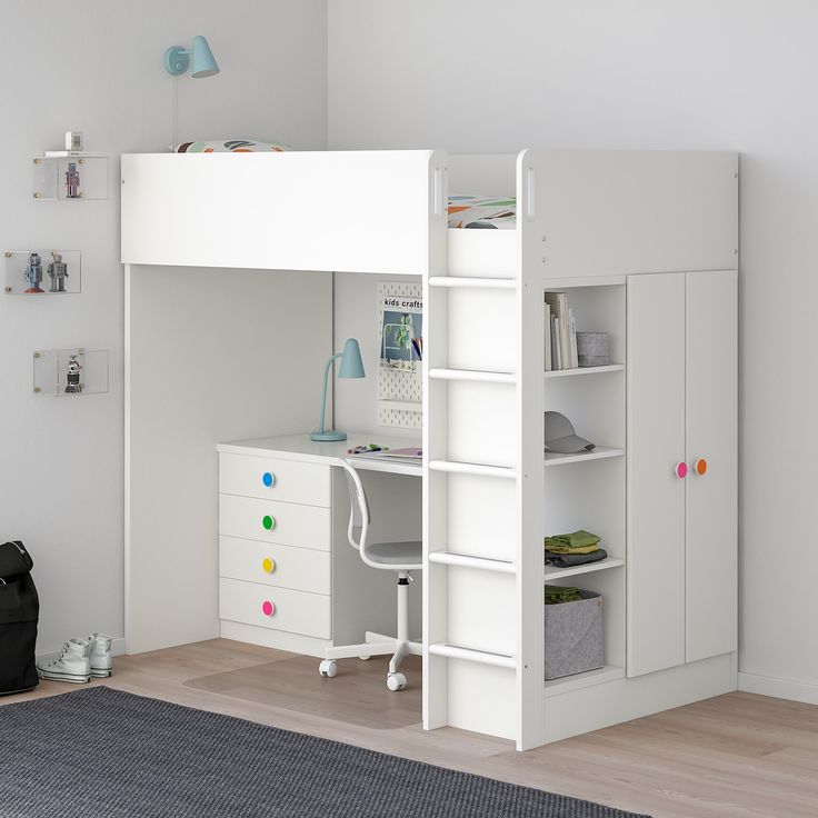 a white loft bed with desk underneath it