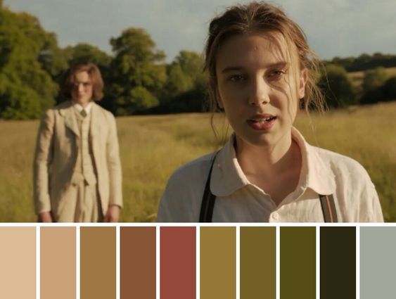 a man and woman standing in a field next to each other with color swatches