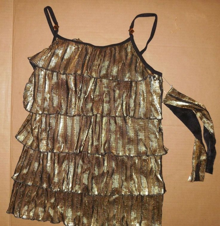 This is a brand new dance costume top, a pretty gold pleated foil in a ruffled camisole. This item was used for the costume catalog shoot, worn only long enough to take a photo. Check the size chart if you are unsure of the size, This is a multi listing, all I have are listed in this listing,(Just click the size you are interested to see. The manufacturer of this costume is Wolff Fording (made in America, Richmond Virginia)so you know these are the finest quality. Great for jazz, theatrical Fitted Gold Tank Top For Party Season, Fitted Gold Camisole For Night Out, Gold Camisole Top For Party, Gold Camisole Tank Top For Parties, Gold Fitted Top With Spaghetti Straps, Glamorous Fitted Gold Tank Top, Fitted Gold Camisole For Summer, Gold Spaghetti Strap Camisole For Party, Gold Camisole For Spring Party