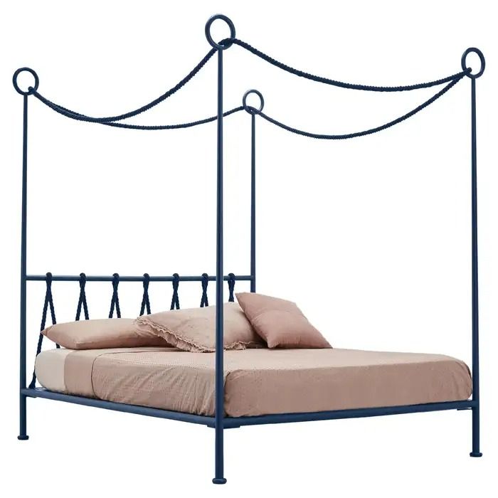 a metal bed frame with an iron headboard and foot board is shown against a white background