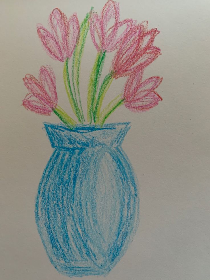 a drawing of flowers in a vase on a piece of paper with colored crayons