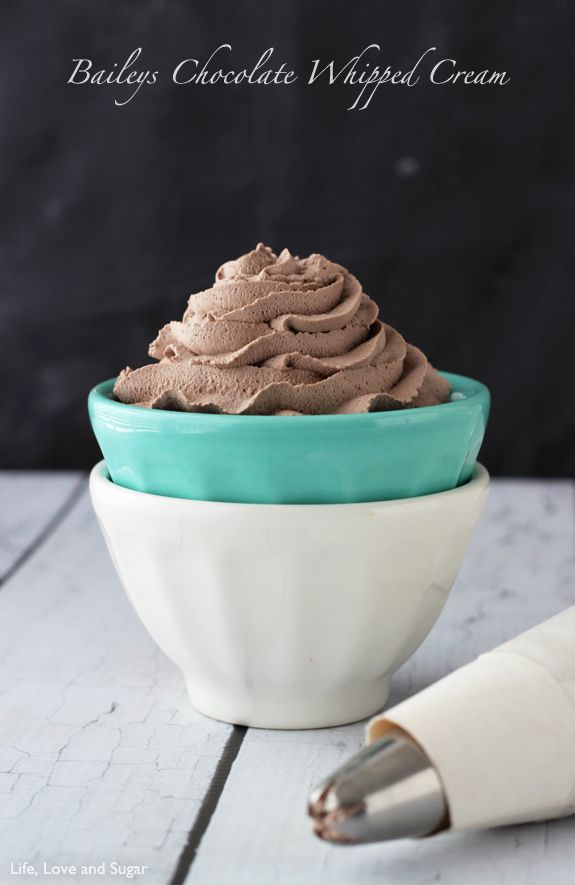 a bowl filled with chocolate whipped cream on top of a table