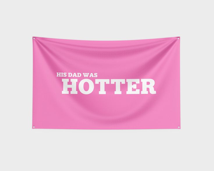 a pink wall hanging with the words, his dad was hotter