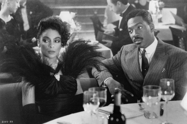 an advertisement for harlem nights featuring two people sitting at a table with wine glasses in front of them