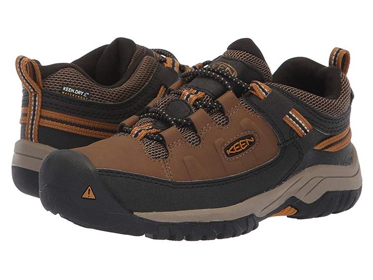 KEEN Kids Targhee Low WP (Little Kid/Big Kid) - Boy's Shoes : Dark Earth/Golden Brown : Hike from mountain-to-mountain with savvy gear by sporting the durable Keen Kids Targhee Low WP Hiking shoe. Sturdy hiking shoe is constructed in a waterproof leather upper with KEEN.Dry finish and breathable mesh underlays featuring Cleansport NXT technology to naturally control unwanted odors. Robust sneaker is constructed with a protective toe bumper, bungee laces with a toggle closure, and an adjustable a Rugged Sports Hiking Boots, Leather Hiking Boots For Trail Running, Rugged Impact-resistant Hiking Boots For Sports, Rugged Impact Resistant Hiking Boots For Sports, Impact Resistant Rugged Hiking Boots For Sports, Brown Fade-resistant Sneakers For Walking, Brown Fade-resistant Walking Sneakers, Fade-resistant Brown Sneakers For Walking, Sporty Low-top Hiking Boots