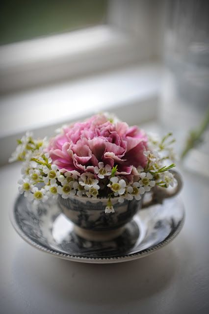 a vase with flowers in it sitting on a table