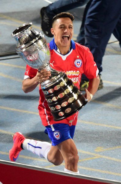 a man running with a trophy in his hand