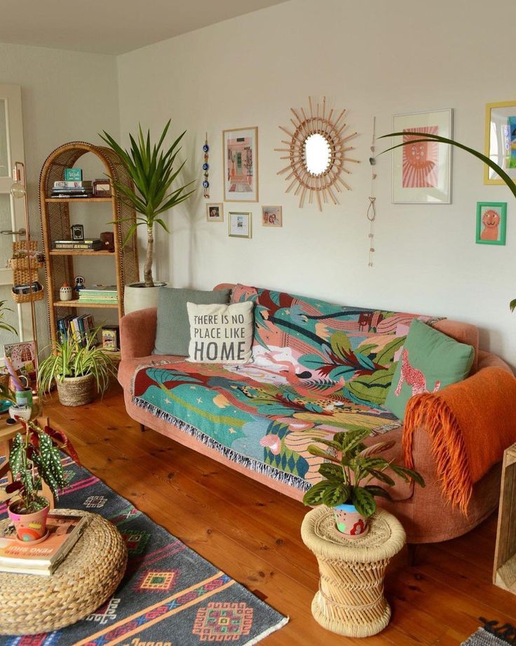 a living room filled with furniture and plants