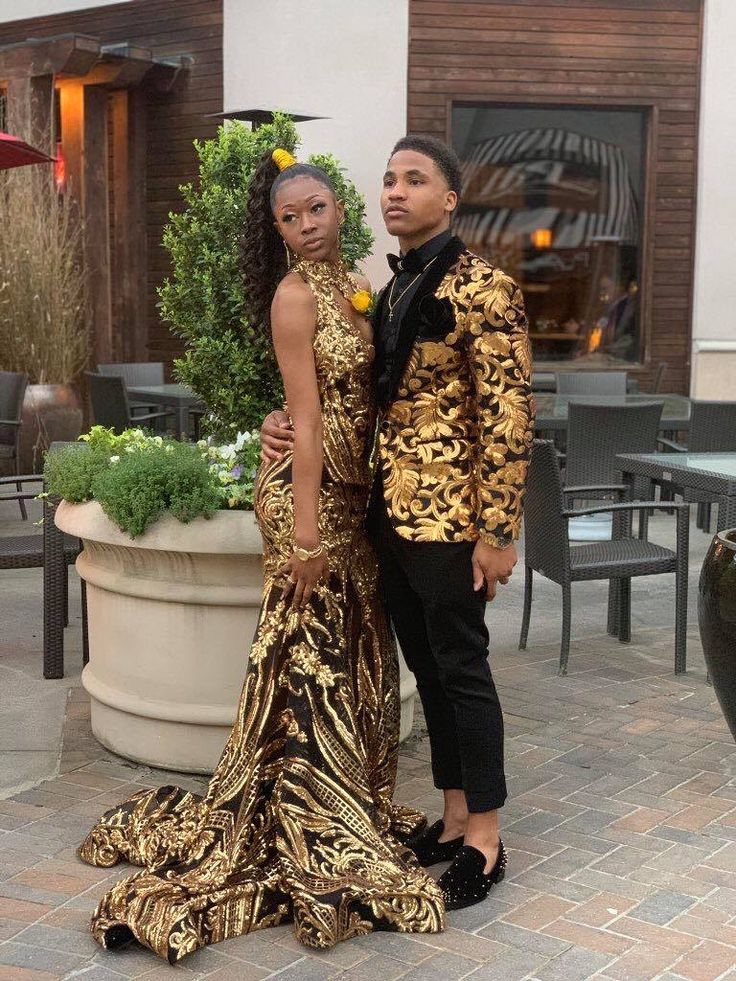 Black And Gold Prom Couple Outfit, Black And Gold Formal Outfit Men, Black And Gold Homecoming Couple, Gold Tuxedo Prom, Black And Gold Tuxedo Prom, Gold Prom Suits For Men, Black And Gold Prom Dress Couple, Gold Prom Outfits For Couples, Black And Gold Prom Couple