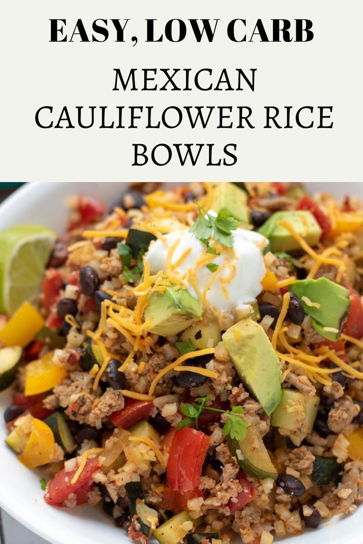 mexican cauliflower rice bowls with avocado and sour cream in the middle