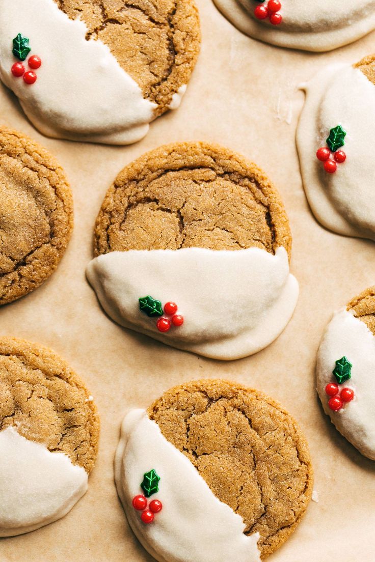 cookies decorated with white icing and holly leaves