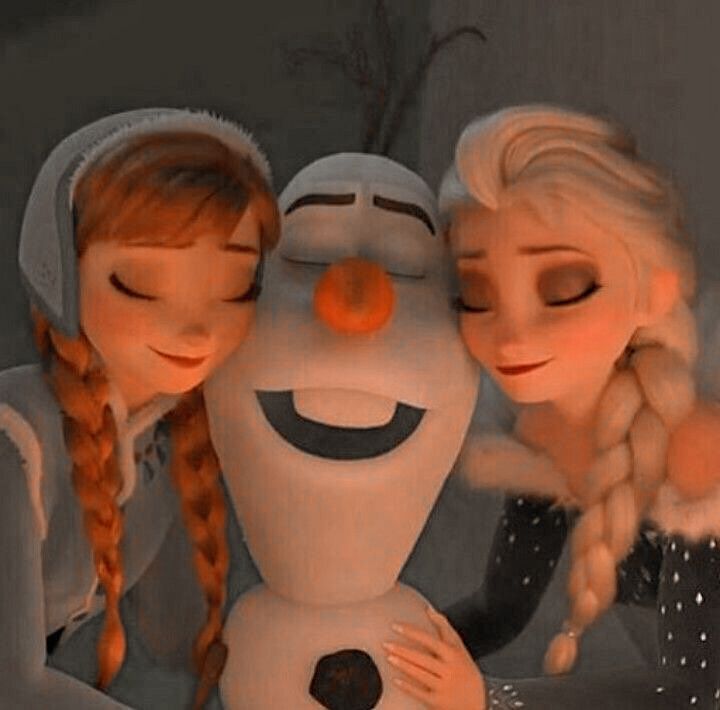 two girls are hugging a snowman in front of the camera with their eyes closed