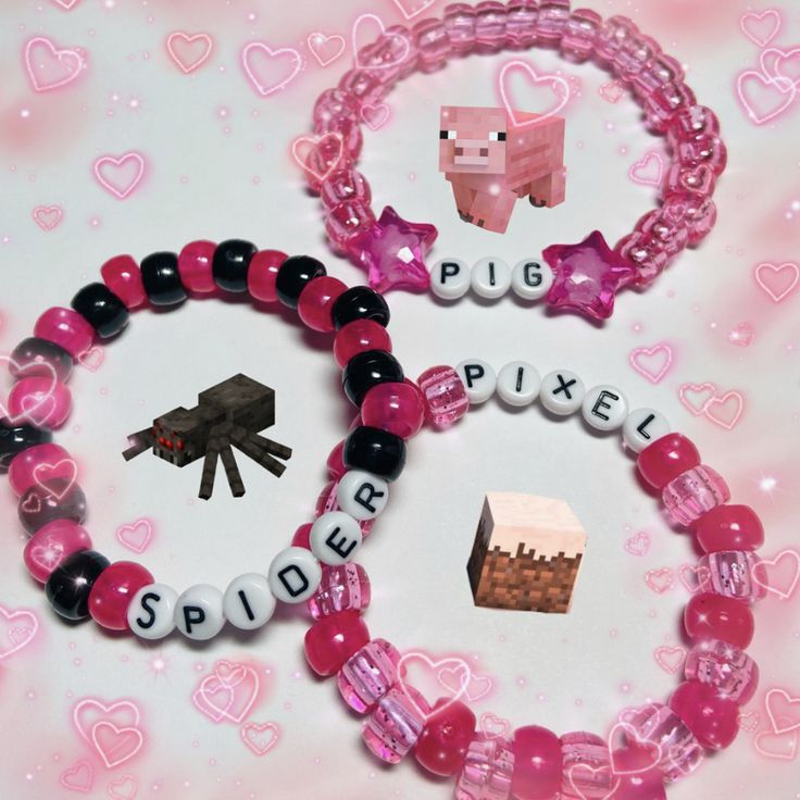 two bracelets with pink and black beads, one has a small cow on it