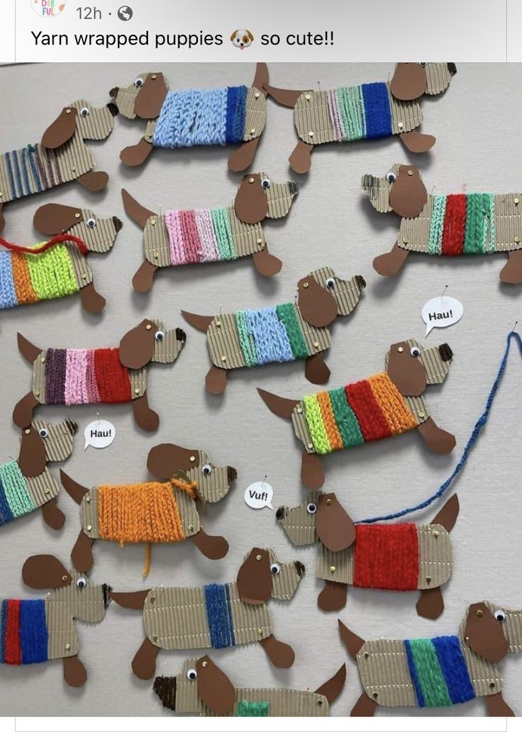 a group of knitted dachshunds hanging on a wall next to each other