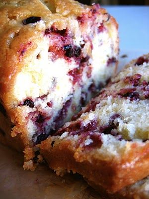 a loaf of blueberry bread cut in half