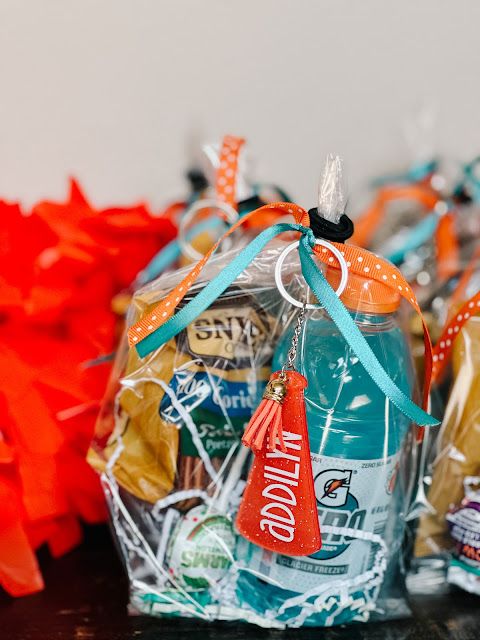 two bags filled with candy and candies on top of a table