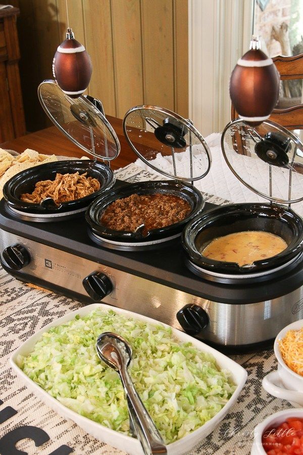 an assortment of food is displayed on a buffet table