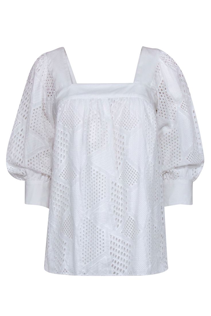 Look simply sweet in this darling blouse from Milly. Crafted from 100% crisp white cotton, this charming top features embroidered eyelet designs in a playful geometric pattern. Style this feminine gem with blue jeans and a brown woven slide for an effortless weekend look! Shell 100% Cotton Combo 75% Cotton, 20% Polyamide, 5% Elastane Lining 100% Cotton Made in USA Square neckline Button keyhole at neck Buttoned cuffs 3/4 length sleeves Bust 33" Waist 42" Shoulder to hem 26" Sleeve length 19.5" Chic Cotton Blouse With Cutwork Hem, Cotton Blouse With Cutwork Hem For Daywear, Spring Daywear Blouse With Cutwork Hem, Chic Cotton Eyelet Blouse, Spring Casual Blouse With Cutwork Hem, Chic Cotton Blouse With Eyelet Details, Chic Fitted Blouse With Cutwork Hem, Fitted Blouse With Cutwork Hem For Spring, Summer Cotton Eyelet Blouse