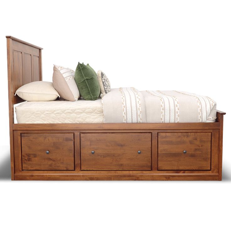 a wooden bed with drawers underneath it and pillows on the top shelf, in front of a white background