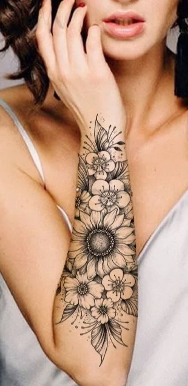 a woman with a tattoo on her arm