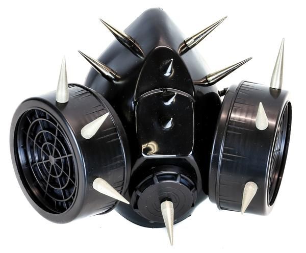 a black gas mask with spikes on it