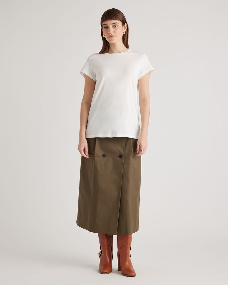 A wardrobe basic that feels anything but. Our Cotton Modal Crewneck Swing Tee is made with a super soft and stretchy cotton blend that's wrinkle-resistant with a seriously smooth finish.  | Quince | Women's Cotton Modal Crew Neck Swing Tee in White, Size Medium, Cotton/Modal Classic Stretch T-shirt For Workwear, Versatile Spring T-shirt For Casual Gatherings, Casual Workwear T-shirt With Shirttail Hem, Versatile White Cotton T-shirt, Stretch T-shirt For Workwear In Fall, Versatile Relaxed Fit T-shirt For Spring, Classic Spring Tops With Minimal Stretch, Versatile Cotton T-shirt For Fall, Fall Cotton T-shirt Versatile Style