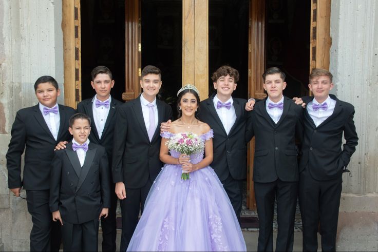 a group of young men and women standing next to each other