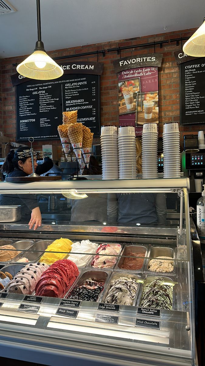 an ice cream shop with lots of desserts on display