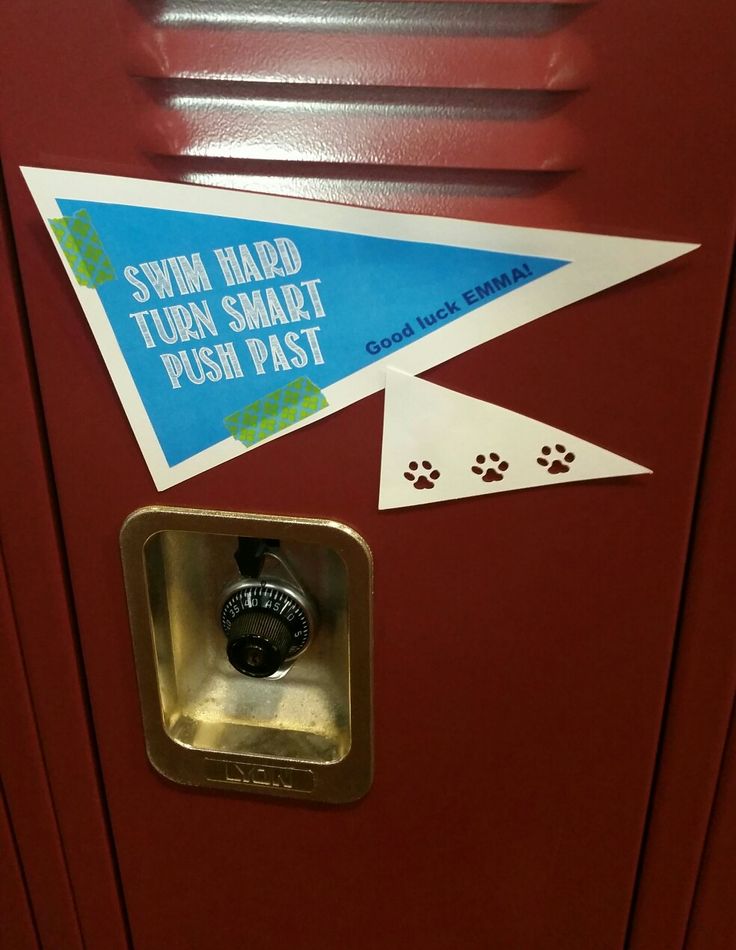 a red locker with some stickers on the door and paw prints in front of it