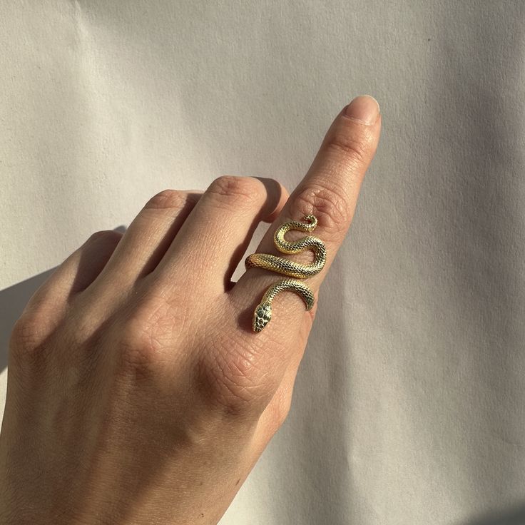 14k Solid Gold Snake Ring | Certified Solid Gold Serpent Ring, Witchcraft Jewelry, Gift for Her 14k Solid Gold Snake Ring 🐍 - The ring is made of certified 14k Solid Gold (585) - The ring is adjustable by hand which can fit on all types of fingers - Easy to wear / Lightweight - Detailed Engraving Historically, serpents and snakes represent fertility or a creative life force. As snakes shed their skin through sloughing, they are symbols of rebirth, transformation, immortality, and healing. ● Pur Gemstone Snake Ring Gift, Unique Snake-shaped Ring For Anniversary, Snake-shaped Engraved Jewelry Gift, Unique Snake Shape Rings For Anniversary, Luxury Sterling Silver Snake Ring Gift, Unique Snake-shaped Anniversary Rings, Unique Tarnish Resistant Open Ring Jewelry, Engraved Snake-shaped Jewelry Gift, Unique Tarnish-resistant Open Ring Jewelry