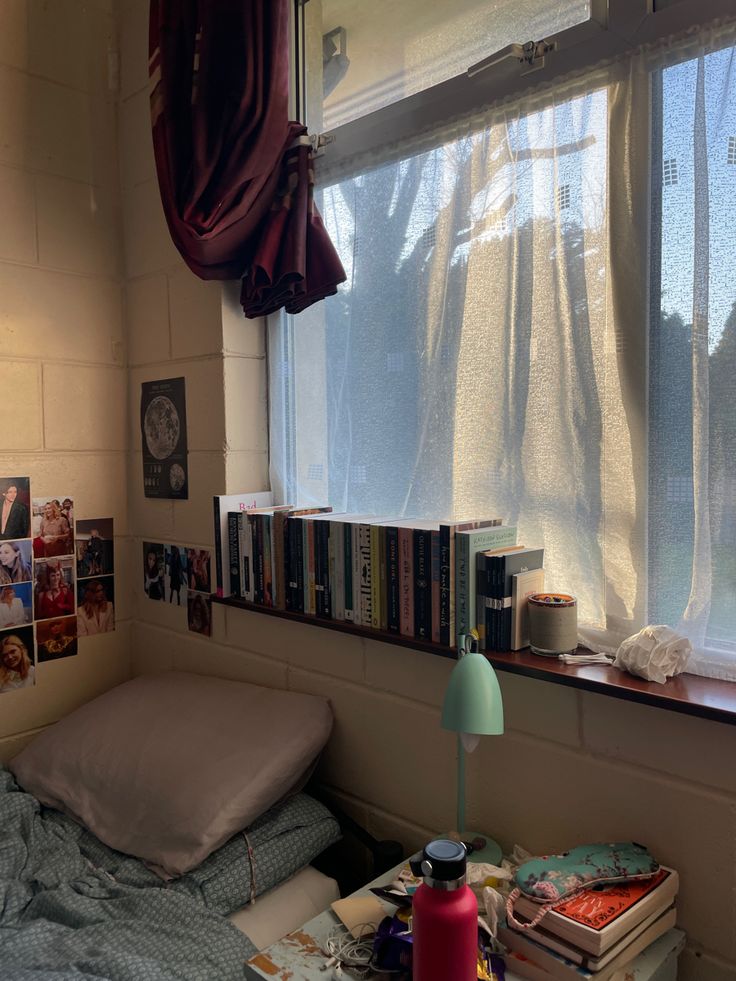 a room with a bed, bookshelf and window