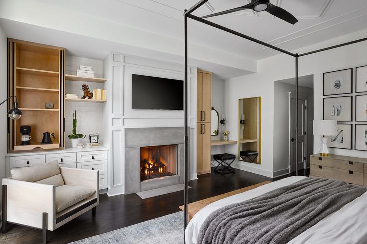 a bedroom with a fireplace and bed in it