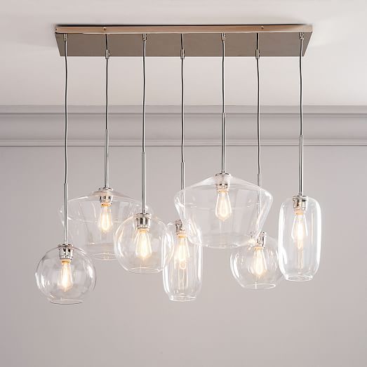 five clear glass lights hanging from the ceiling