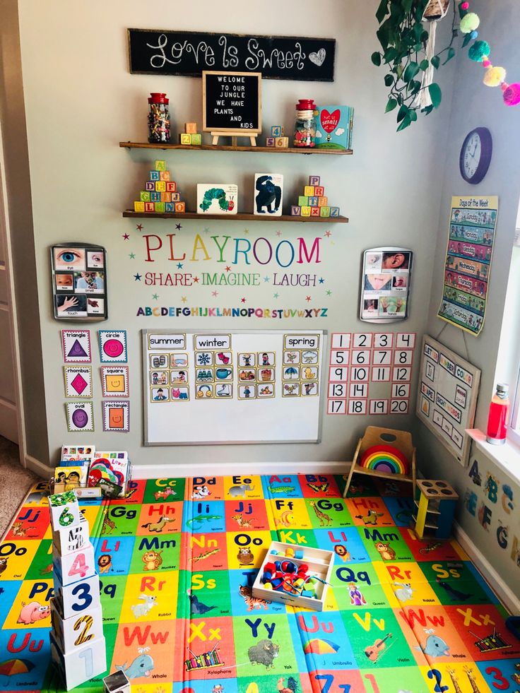 a playroom with colorful tiles and toys on the floor