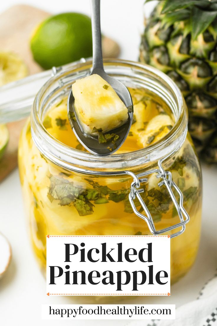 pickled pineapple in a mason jar with a spoon