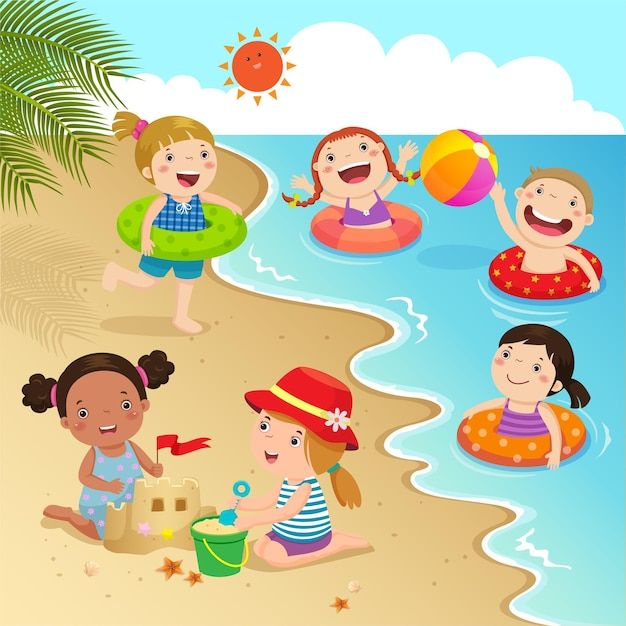 children playing on the beach with toys and inflatables stock photo - 9579