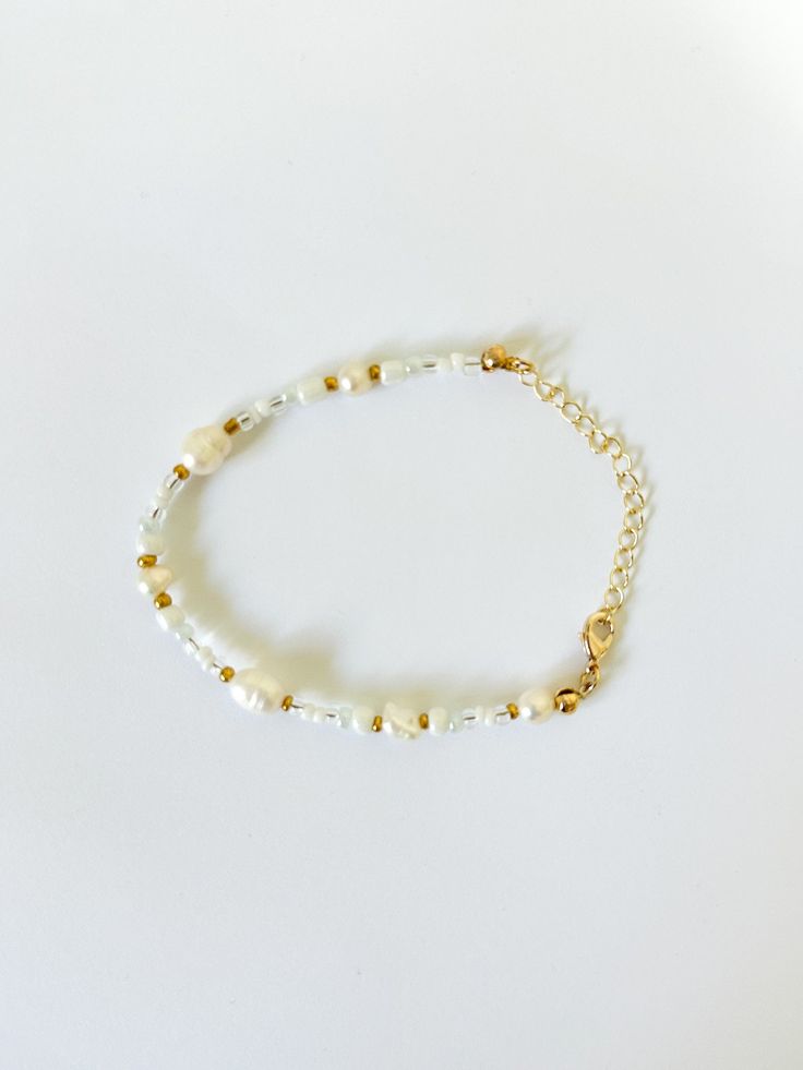 Beaded Bracelet   Hand beaded - real fresh water pearls and seed beads Tarnish Resistant   Delicate - handle with care Adjustable in size! Handmade Adjustable Rondelle Pearl Bracelet, Pearl Beaded Bracelets With Round Beads, Pearl Chain Beaded Bracelets, Bohemian Pearl Bracelet With Pearl Charm, Pearl White Beaded Bracelets With Round Beads, Pearl White Beaded Bracelet With Round Beads, Dainty Beaded Pearl Bracelet, Bohemian Pearl Bracelet, Pearl Bracelets With Gold Round Beads