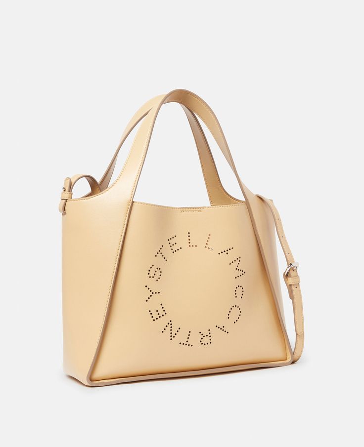 Women Cornflake Stella Logo Crossbody Bag | Stella McCartney US Beige Logo Tote Shoulder Bag, Beige Top Handle Shoulder Bag With Logo, Beige Double Handle Bag With Logo, Chic Crossbody Shoulder Bag With Logo, Designer Beige Shoulder Bag With Logo, Luxury Shoulder Bag With Logo And Double Handle, Luxury Shoulder Bag With Double Handle And Logo, Luxury Double Handle Shoulder Bag With Logo, Beige Top Handle Bags With Logo