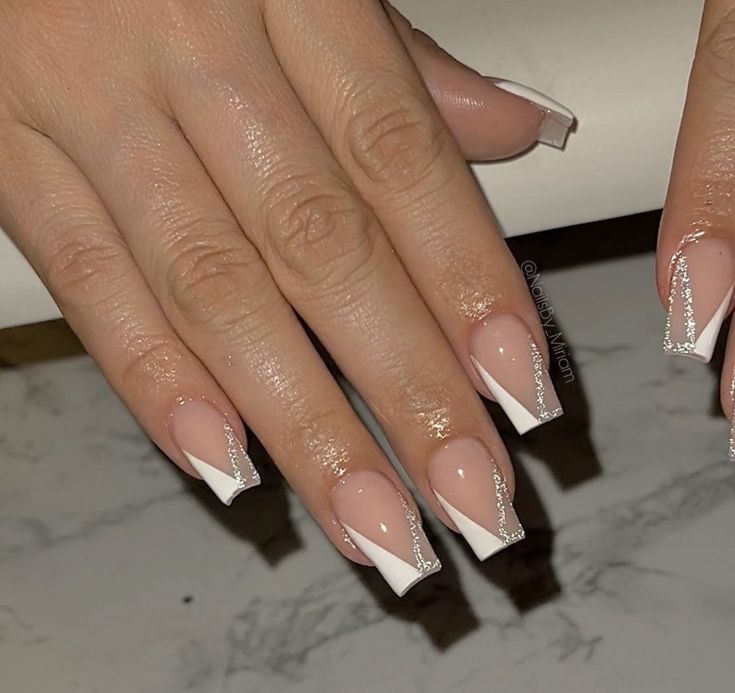 White Silver Tip Nails, Acrylic Nail Designs White And Silver, French Nails With Silver Design, Triangle French Tip Nails With Glitter, French Tip And Silver Nails, French Tip Nails White And Silver, White French Tip Acrylic Nails Coffin Medium, Prom Nails Acrylic Classy Silver, Gelx Apres Nail Designs Square